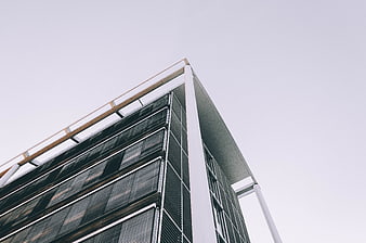 Low angle view of modern glass office building corner