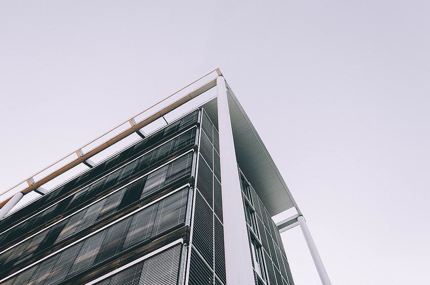 Low angle view of modern glass office building corner