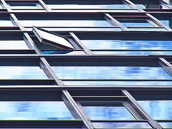 Modern Glass Building Facade with Open Window