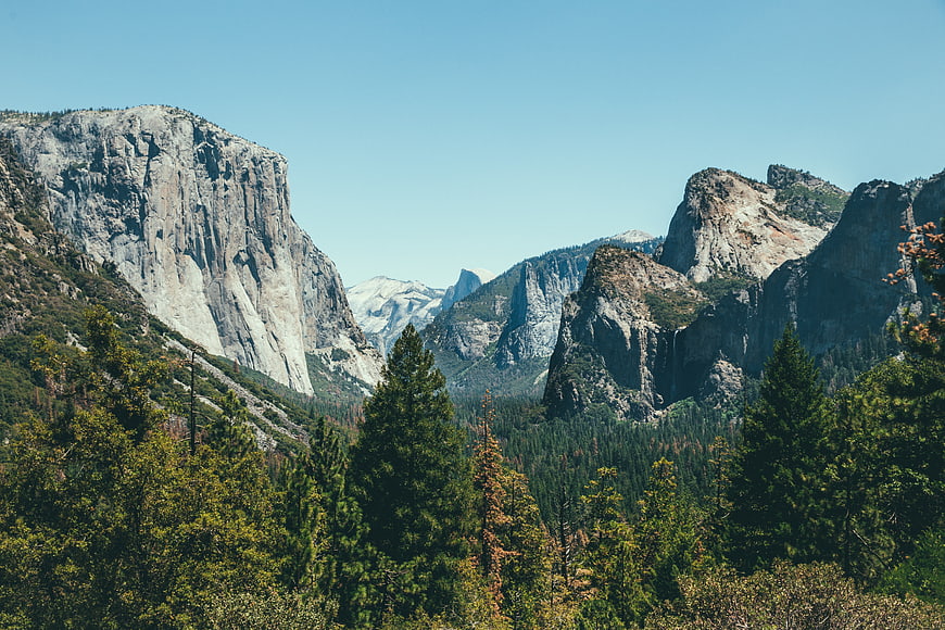 Majestic granite mountain peaks and pine forest landscape
