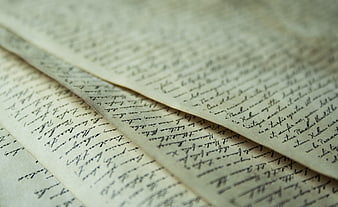 Close-up of vintage handwritten letter on aged paper
