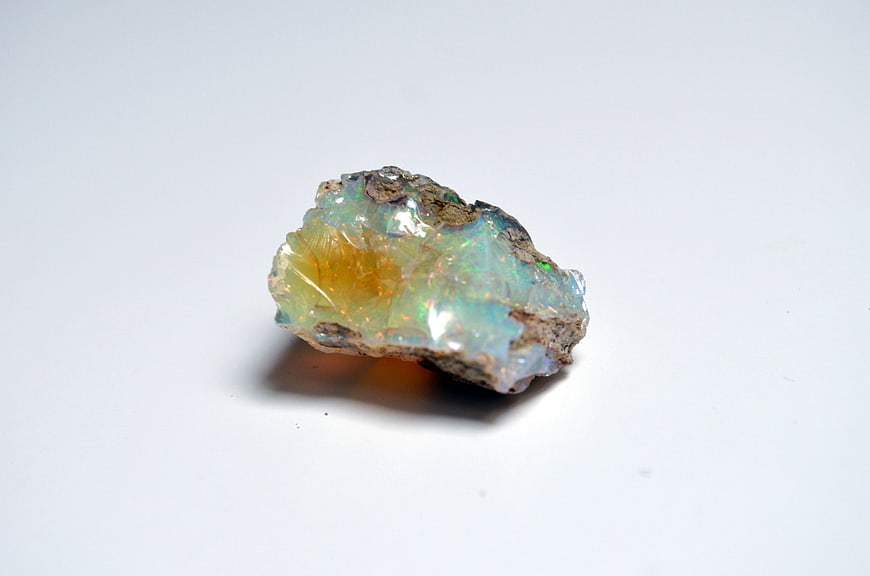 Raw Opal Mineral Specimen on White Background
