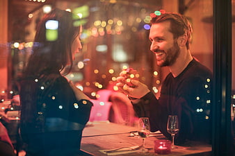 Romantic Marriage Proposal at Candlelit Restaurant