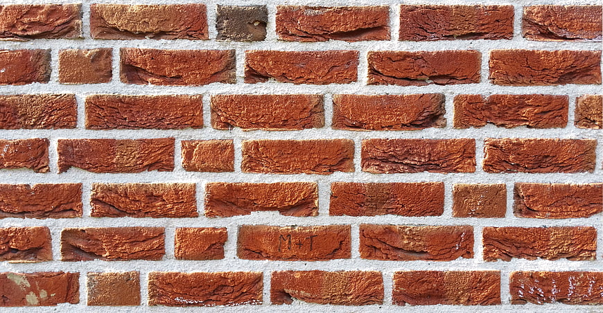 Textured Red Brick Wall Background with White Mortar