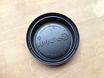 Black Coffee Cup Lid on Wooden Table