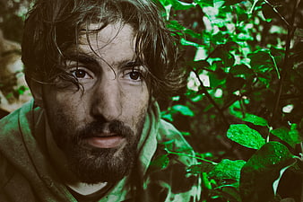 Intense Portrait of Man in Forest with Green Filter