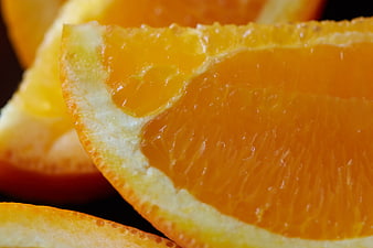 Close-up of juicy orange slice with vibrant citrus texture