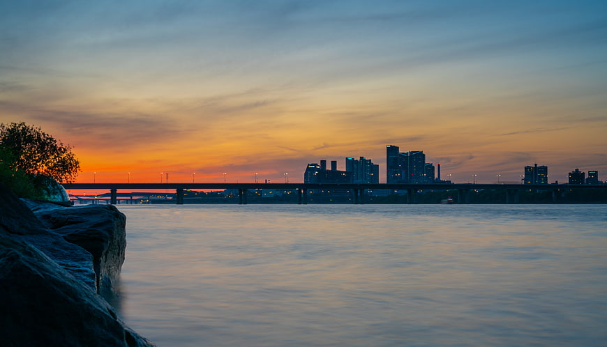 Sunset over Han River with Seoul Skyline and Bridge