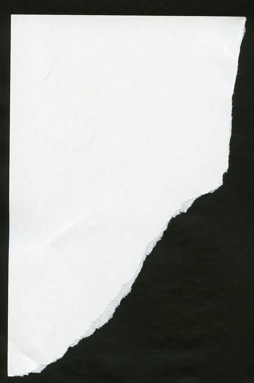 Torn White Paper Edge on Black Background