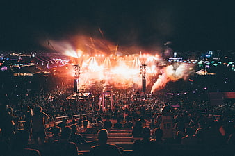 Nighttime Music Festival Crowd With Bright Stage Lights