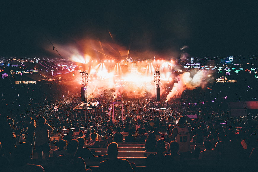 Nighttime Music Festival Crowd With Bright Stage Lights