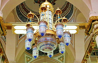 Ornate Islamic Chandelier With Arabic Calligraphy In Mosque Interior
