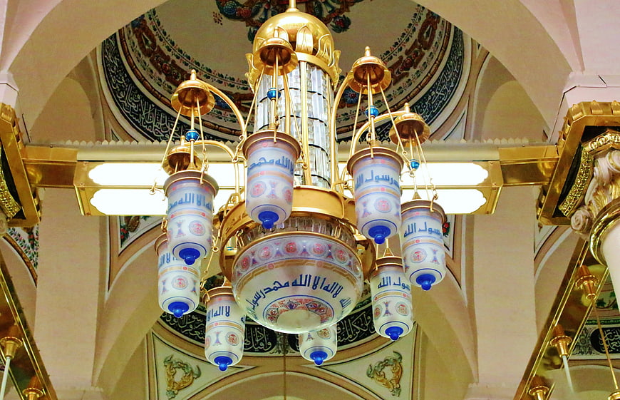 Ornate Islamic Chandelier With Arabic Calligraphy In Mosque Interior