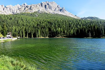 Scenic Alpine Lake with Dolomite Mountains and Pine Forest