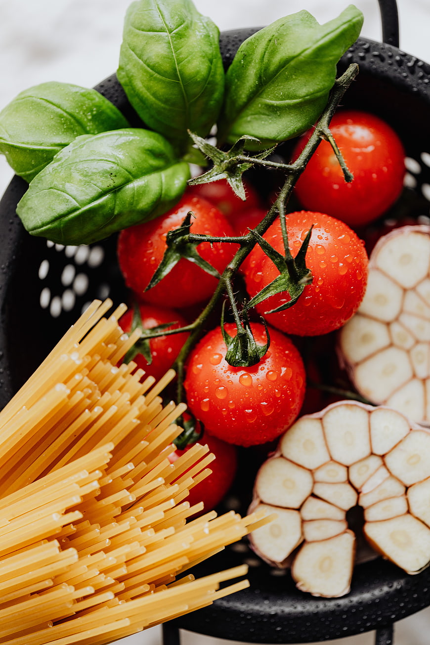 Fresh Italian pasta ingredients with tomatoes, basil, and garlic