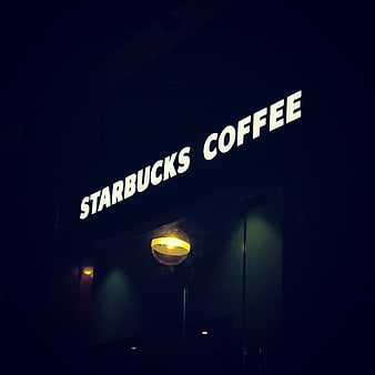 Illuminated Starbucks Coffee Sign at Night