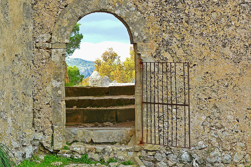 Ancient Stone Archway With Iron Gate And Stairs