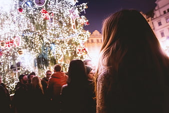 Woman Viewing Christmas Tree Lights at Night Market