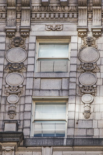 Ornate Stone Building Facade with Symmetrical Windows