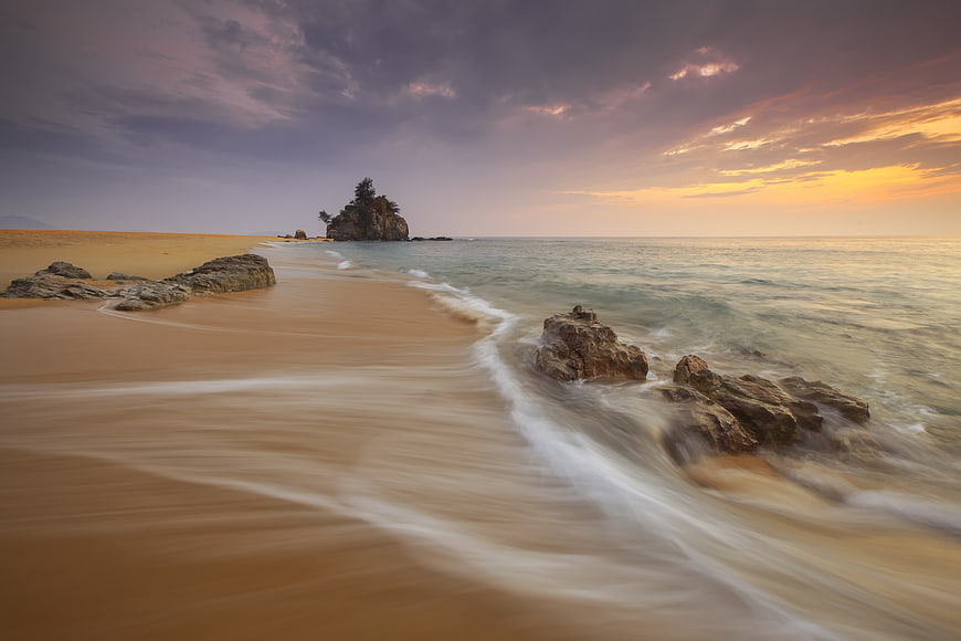 Long Exposure Sunset at Ilhabela Beach with Rock Formation
