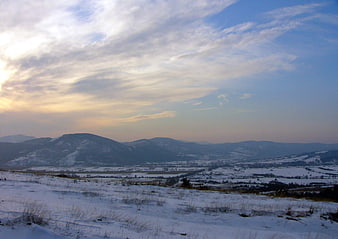 Snowy Winter Mountain Landscape at Sunset