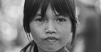 Black and white portrait of young girl looking at camera