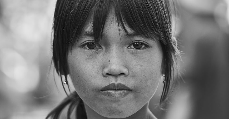 Black and white portrait of young girl looking at camera