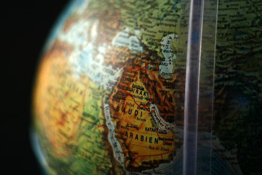 Close-up of a globe map showing the Middle East and Saudi Arabia