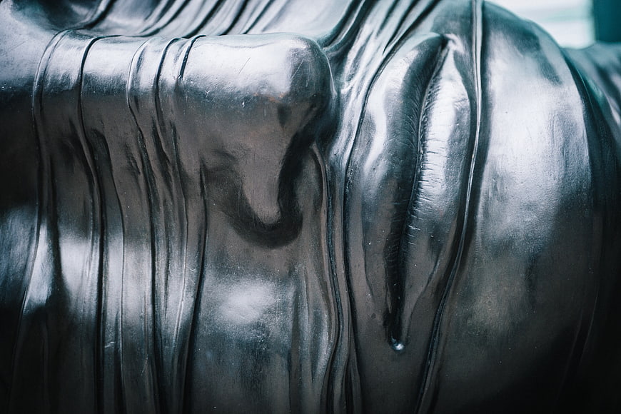 Close-up of silver Buddha statue face sculpture