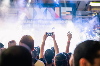 Concert Audience Filming Live Performance with Smartphone