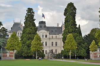 Grand French Hotel with Flag in Annecy Park