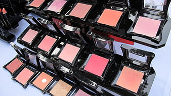 Display of ILLAMASQUA Blush Compacts in Various Pink and Peach Shades