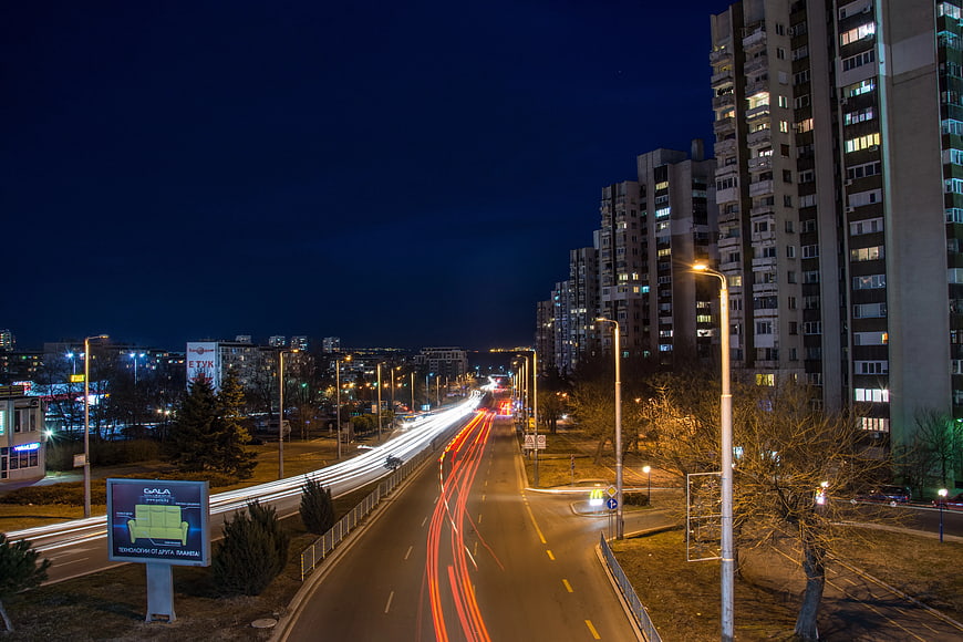 Night Cityscape with Long Exposure Light Trails on Highway