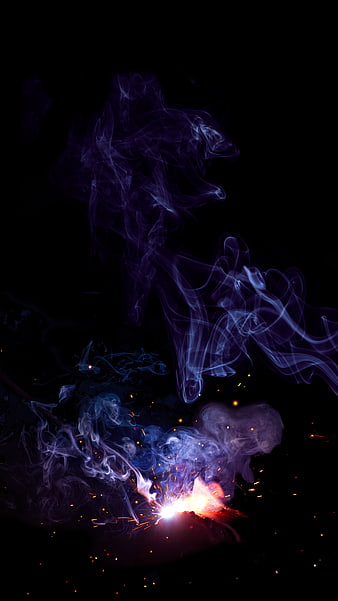 Abstract Purple Smoke and Orange Sparks on Black Background
