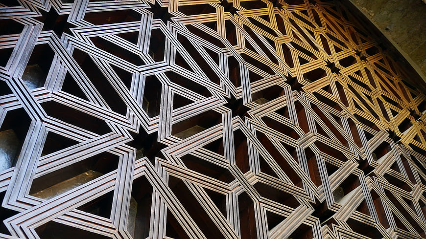 Intricate Islamic geometric wooden ceiling pattern