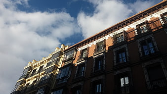 Low angle view of historic Madrid architecture against blue sky