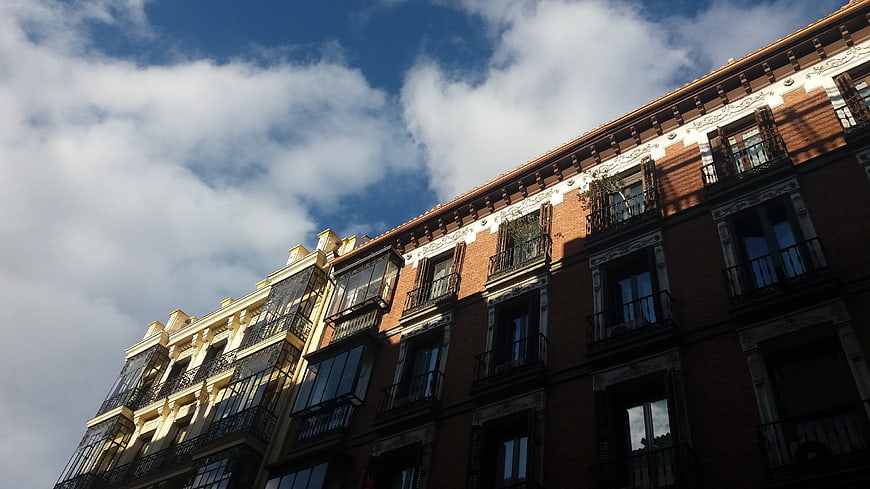 Low angle view of historic Madrid architecture against blue sky