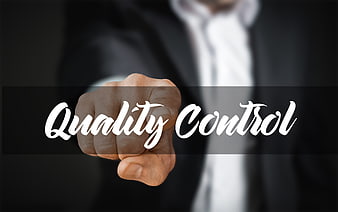 Businessman Pressing Finger On Quality Control Text
