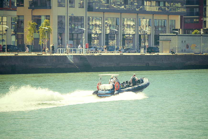 Rigid Inflatable Boat Speeding on Urban River