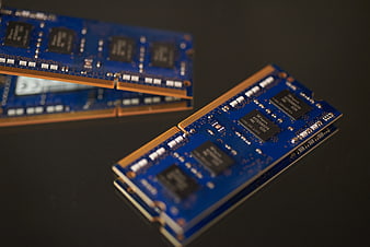 Blue DDR3 RAM Sticks on Black Surface