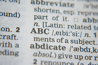 Close-up of dictionary page with word ABC and definitions