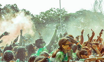 Crowd Celebrating Holi Festival With Colorful Powder