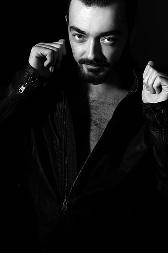 Dramatic Black and White Portrait of Man in Leather Jacket
