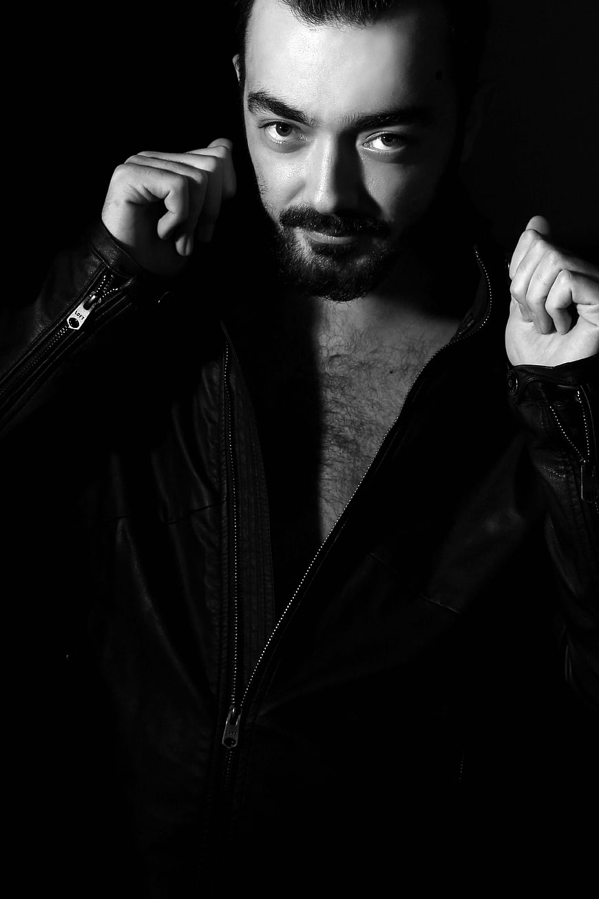 Dramatic Black and White Portrait of Man in Leather Jacket