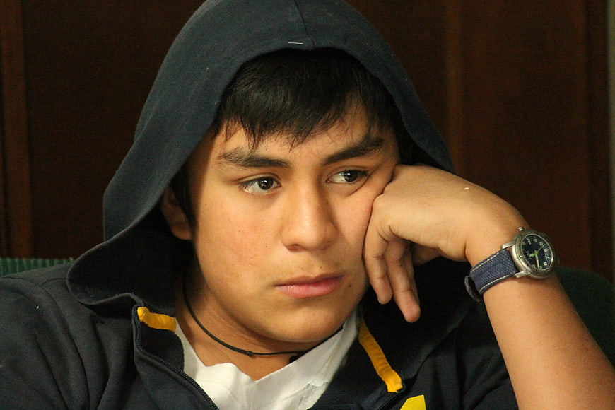 Pensive Teenage Boy Wearing Hoodie And Watch