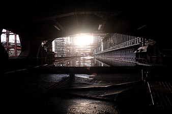Dark Industrial Factory Interior With Bright Sunlight