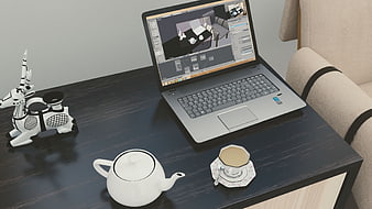 3D Rendered Workspace with Laptop, Teapot, and Decorative Sculpture