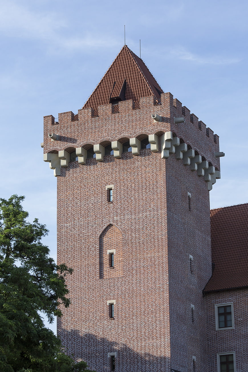 Red Brick Castle Tower with Crenellations and Tiled Roof