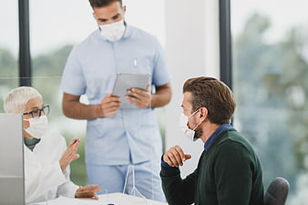 Doctor and Patient Consultation with Protective Masks