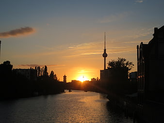 Berlin TV Tower Silhouette at Sunset Over River
